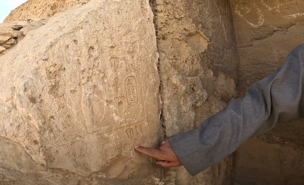 Decoding Hieroglyphs at the Pyramids of Giza. Decoding the hieroglyphs, which shows the lotus flower and the scarab symbols.